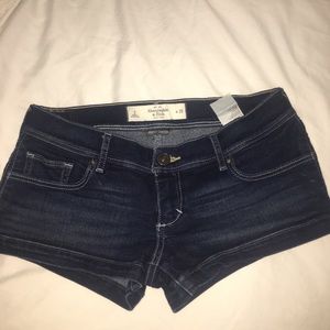 Low-rise dark wash shorty short jean shorts